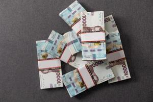 bundles of hryvnia. A stack with hryvnia. Much money. Close-up. photo