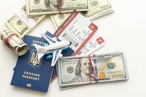 Plane on dollar cash background, travel with airplane concept. photo