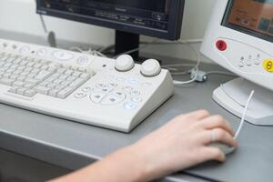 Doctor using laptop and electronic medical record , EMR system. Digital database of patient's health care and personal information on computer screen. Hand on mouse and typing with keyboard photo