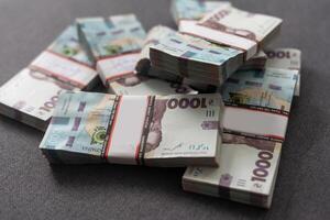 bundles of hryvnia. A stack with hryvnia. Much money. Close-up. photo