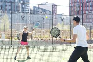 Padel lesson with a coach, personalized instruction in a supportive environment. photo