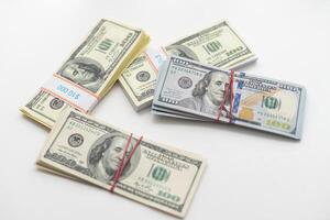 roles dollar notes in front of white background photo