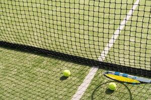 Tennis net on a green field photo