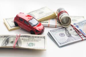 Small decorative car model, a lot of cash dollars of USA, credit for car concept photo