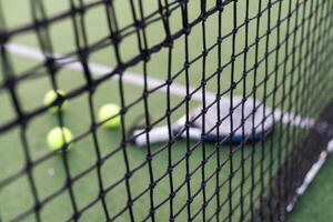 Set of sport equipment on green grass photo