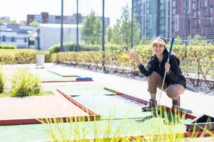 Family Time Playing Mini-Golf In The Summer photo