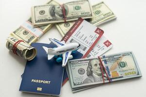 Plane on dollar cash background, travel with airplane concept. photo