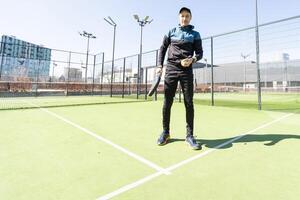 man playing paddle tennis at indoors pitch photo