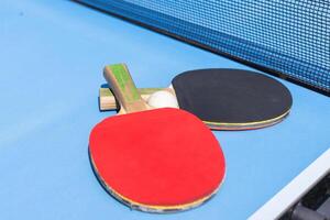 table tennis ball and paddle photo