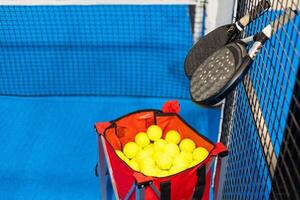 paddle rackets on the playing court photo