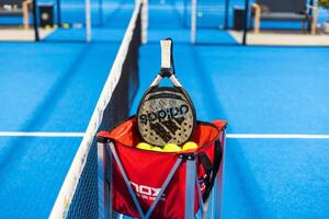 Kyiv, Ukraine. March 22, 2024, Paddle tennis rackets on the court photo