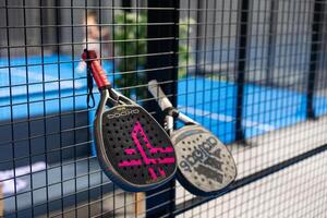 Kyiv, Ukraine. March 22, 2024, Paddle tennis rackets on the court photo