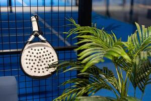 rackets and paddle balls on a court ready to play photo