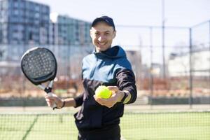 man playing paddle tennis at indoors pitch photo