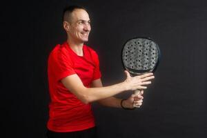 Young man playing the paddle photo