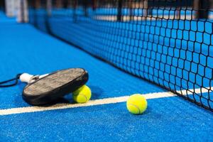 Paddle objects on blue turf photo