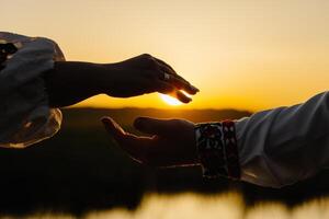 Intimate moment between two people holding hands photo