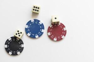 Gambling chips falling isolated on white photo