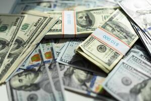 Stacks of hundred dollar bills photo