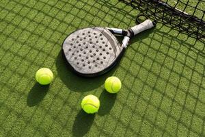 Paddle tennis racket and ball photo