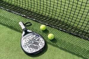 Ukraine Kyiv, April 02 2024. Paddle tennis racket and ball photo