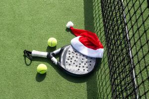 Christmas Open Padel Tournament. Poster for social networks for New Year's games. Padel tennis racket on tournament. paddle racket on court photo