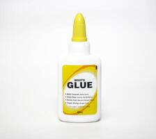 Bottle of white glue isolated on white background photo