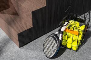 Padel tennis racket. Background with copy space. Sport court and balls. photo