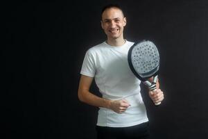 Young man playing the paddle photo