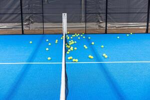 Tennis balls fall over on the tennis playground photo