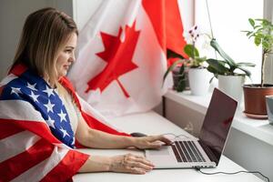 woman with laptop and usa flag. Foreign languages learning, educational online course photo