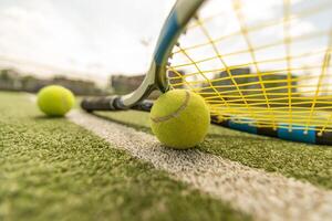 tennis racket with a tennis ball on a tennis court photo