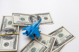 Toy plane and money on background. Travel insurance photo