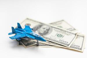 Toy plane and money on background. Travel insurance photo