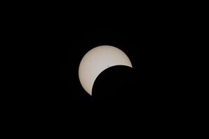 Total Solar Eclipse Beginning - Moon over Sun with Sunspots photo