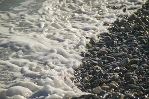 Breaking waves on rocks photo