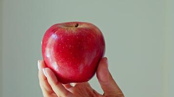 Person holding apple in hand video