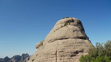 Massive rock formation amidst field video