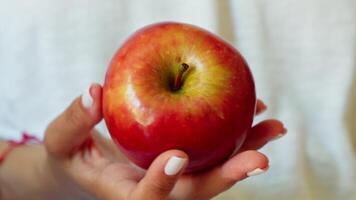 Woman holding apple in hands video