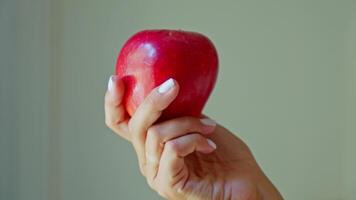 Person holding apple in hand video