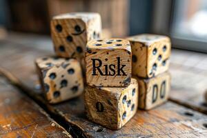 Wooden blocks spelling Risk on the table photo