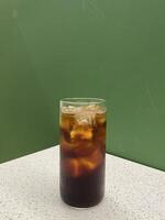 Refreshing Cold Brew Coffee in a Glass on a Table photo