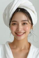 beautiful young aisan woman with towel on her head photo