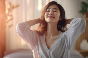 Beautiful young asian woman wake up in the morning photo