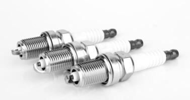 spark plugs on white photo