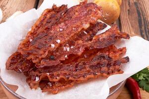 Fried bacon on plate photo