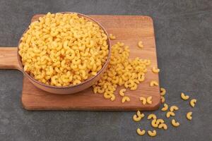 Elbow macaroni in bowl photo