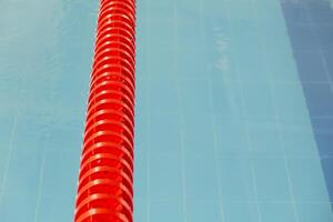 Swimming pool with clear water on a bright sunny day while on vacation and travel. photo