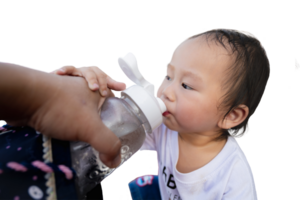 Asian little boy drinking water fed to him by his mother, on a hot day, summer or spring time, drinking clean water to avoid dehydration, health care, isolated background. Toddler one year old. png