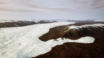 A snow-covered mountain range seen from above video